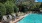 a pool with chairs around it