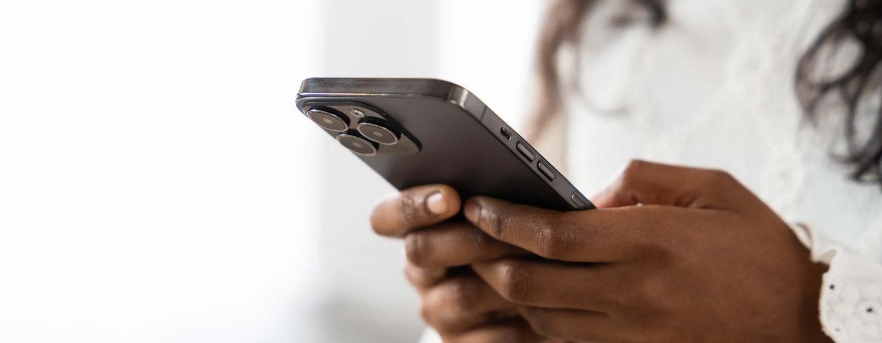 a woman holding a phone