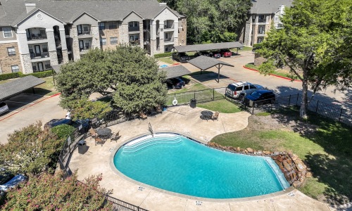 pool with spacious areas and lush landscaping