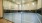 a glass walled indoor basketball court