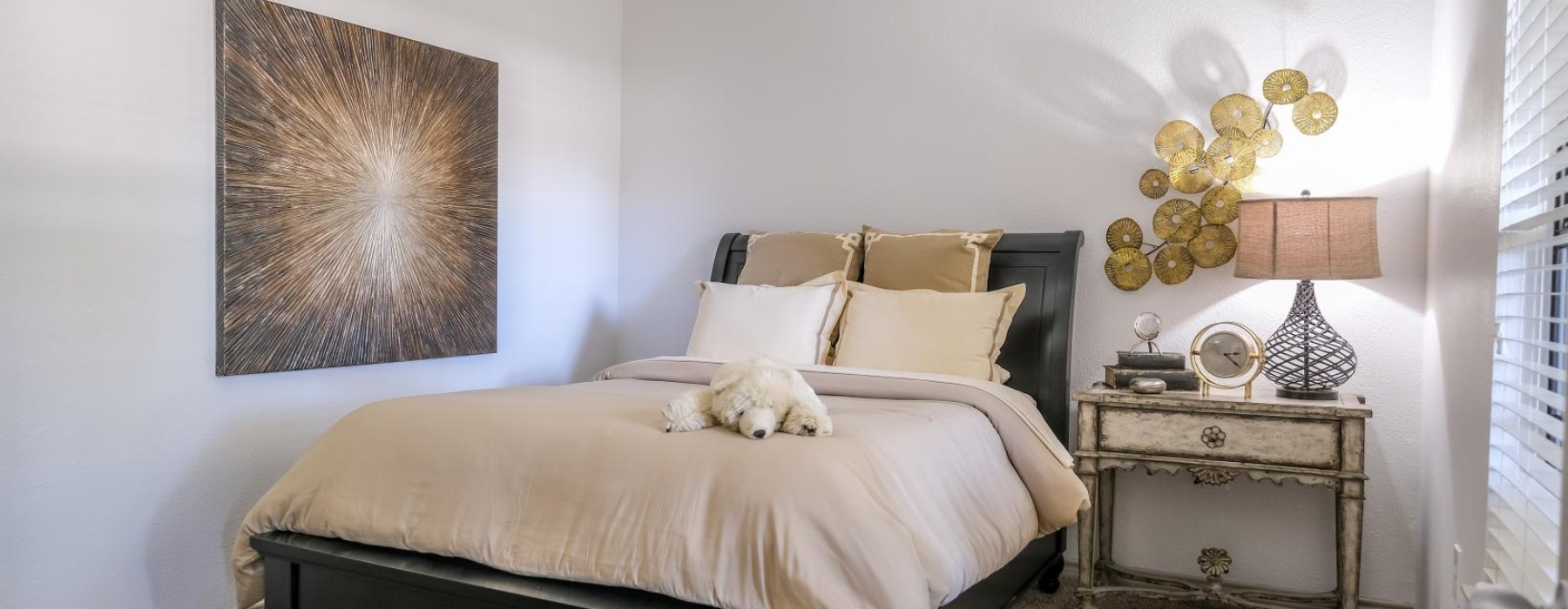 a bedroom with a bed and a lamp