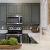 a kitchen with black cabinets