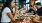 a group of people eating at a restaurant