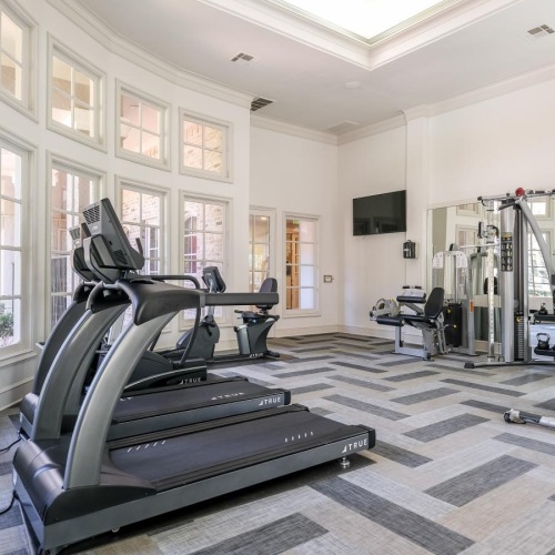 State-of-the-art amenities a gym with treadmills