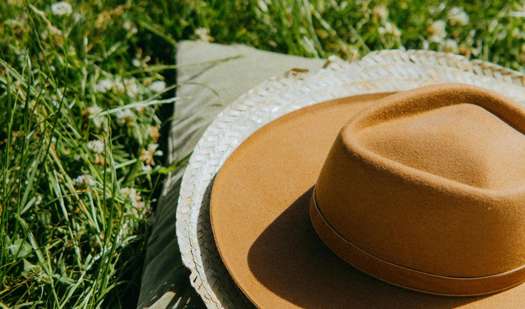 a pair of hats on a blanket